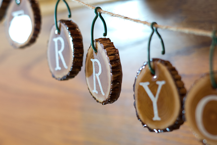 Resin Coated Merry Christmas Wood Slice Garland - resin coated wood slices finished, hang on string to make garland - closeup