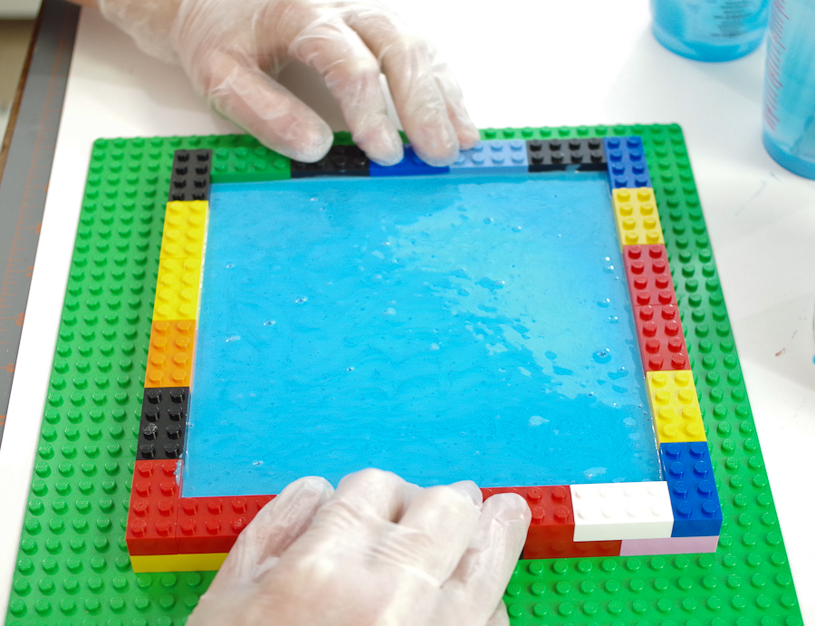 DIY Lego Mold using silicone rubber - After filled, make sure to press down on the legos to ensure the form is solid