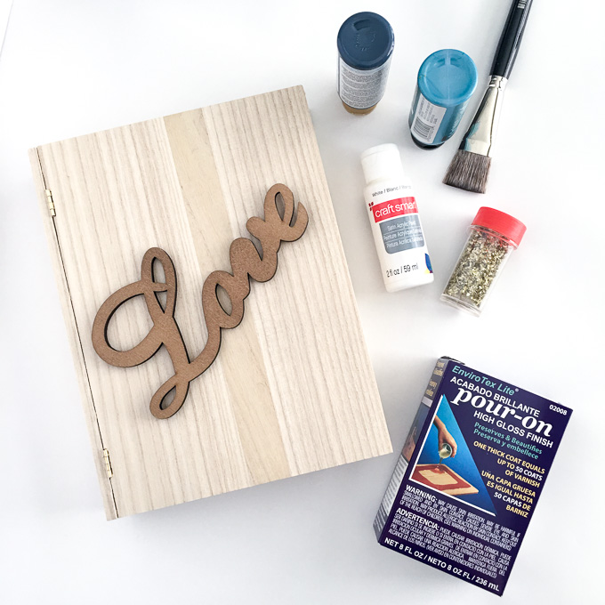 Supplies needed to make a decorative keepsake wooden box with a love sign on the front