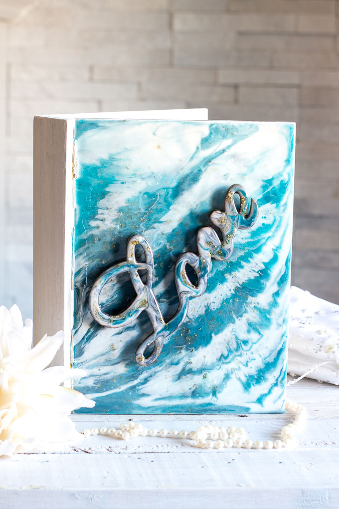 Wooden keepsake book box embellished with a poured resin cover