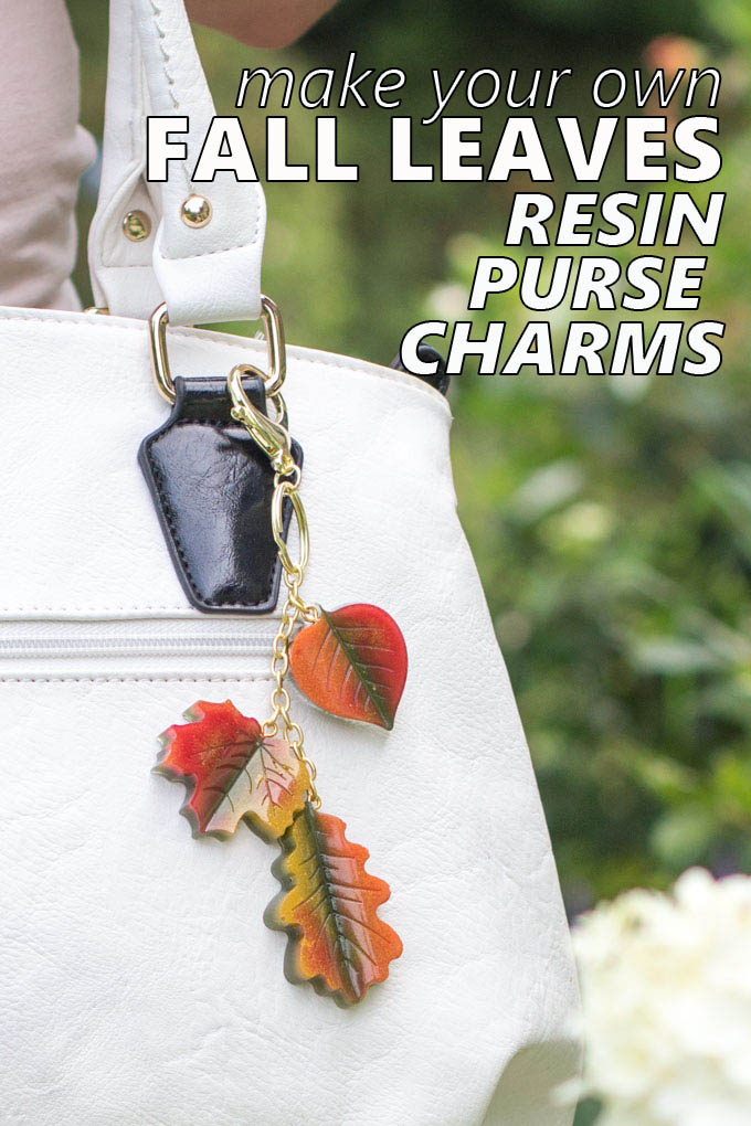 Red, yellow and orange DIY fall leaves resin charms hanging on a purse