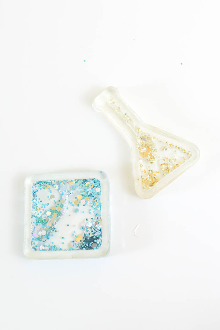 adorable fillable resin charms with blue and gold glitter