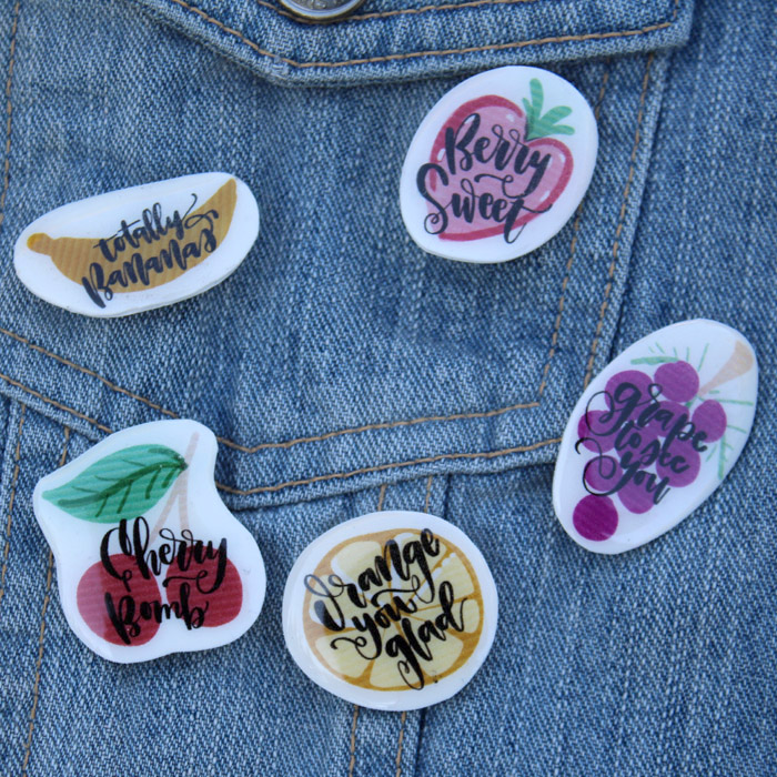 Enamel pins are all the rage and making some witty fruit pun pins is a piece of cake! Using shrink plastic, jewelry resin and pin backs is all it takes! #resincraft #resincrafts #resincraftsblog #resin 