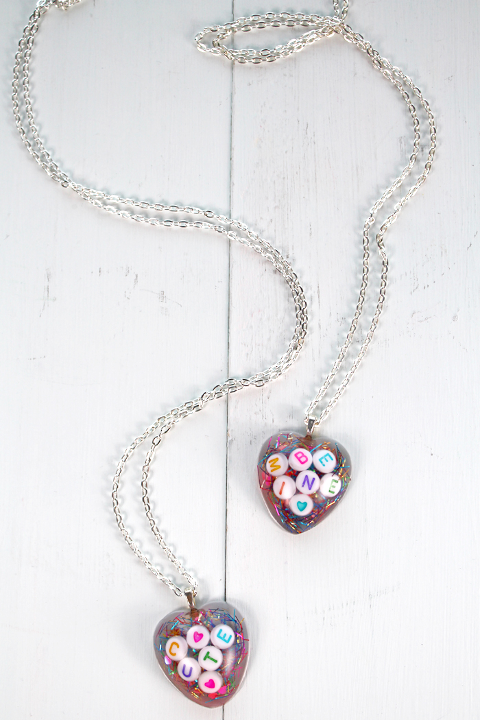 Make a conversation heart resin Valentine necklace with resin for the perfect Valentine's day gift for a friend.
