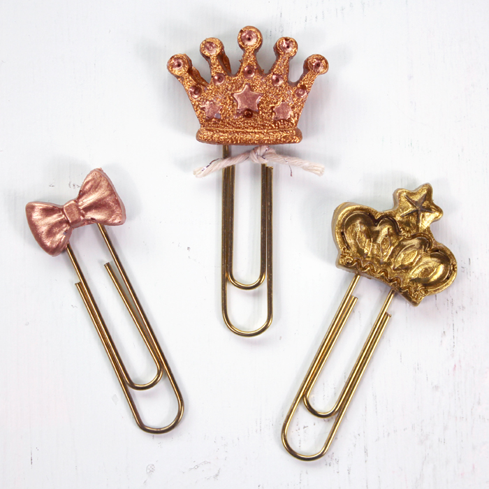 Create the perfect paperclip bookmark with FastCast resin, silicone mold of crowns and bows, and metallic paint and a little twine. 