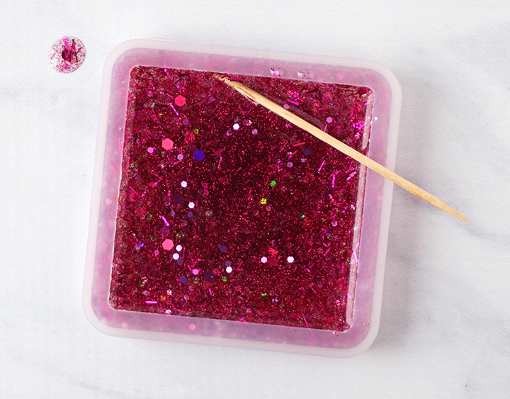Pop resin bubbles with a toothpick