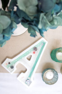 Make your own DIY monogram decor! Use lace, buttons and a wood letter to create a beautiful shabby chic monogram for your gallery wall, nursery or wedding decor.