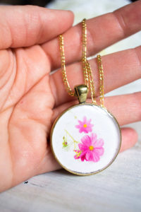 Beautiful DIY resin jewelry. Learn how to make your own birth month flower pendant with floral photos and resin. Great birthday, Mother's Day or Christmas gift idea for her.