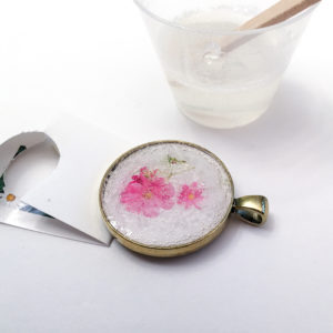 DIY resin jewelry. Tutorial to make your own flower of the month pendant.