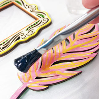Shiny Wood Cutouts - Adding resin to feather