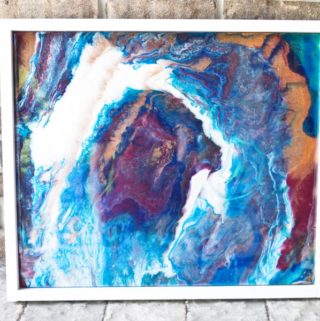 Poured Resin Wall Art - Completed art against brick backdrop