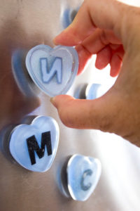 DIY fridge magnets! Monogram heart magnets made with resin. Back-to-school craft idea or loot bag gift idea.