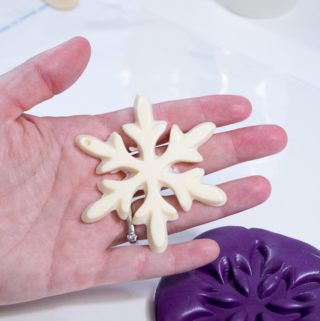 Snowflake mold and castings- the fully cured snowflake in natural color of fastcast