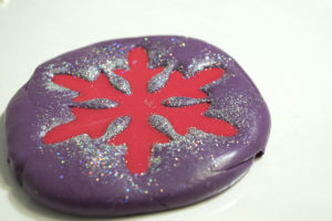 Snowflake mold and castings- pour in more fastcast that had red pigment added to it
