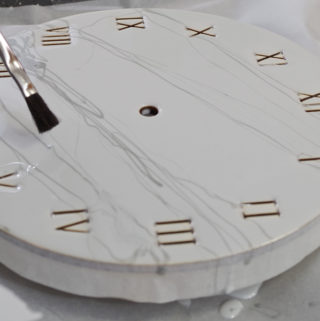 Wood and Resin Clock- use paint brush to lightly spread out the lines