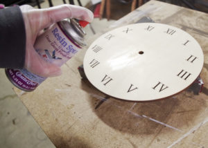 Wood and Resin Clock - spray with resin spray to coat the wooden clock face