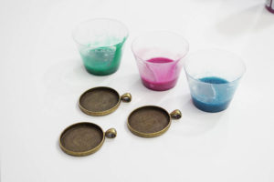 Sparkling Dripped Resin Pendants - add metallic paint to resin - use three colors