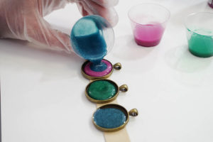 Sparkling Dripped Resin Pendants - add metallic paint to resin - pour second color into each bezel