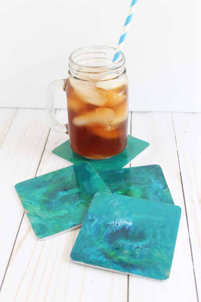 Resin poured marble coasters are the perfect addition to your home! Here we have used sea themed colors but you can mix and match any colors that work with your home decor for this easy resin pour project!