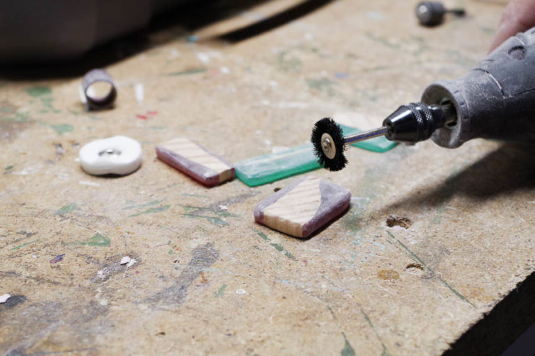 DIY Wood and Resin Necklaces use dremel brush to smooth pendants