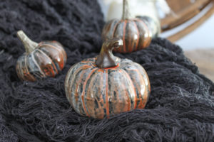 These marbled resin pumpkins are easy to make and perfect for your Halloween and fall decor!