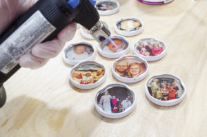 DIY Photo Magnets using resin in milk bottle lids - pop bubbles with micro butane torch