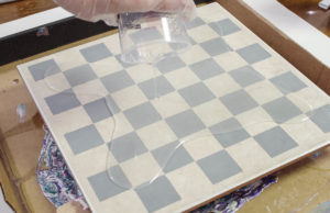 Upcycle Tile to Resin Coated Chess Board - Pour onto Painted Tile making sure to hit the corners