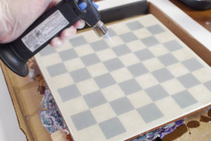 Upcycle Tile to Resin Coated Chess Board - pop bubbles with micro butane torch