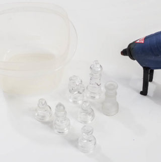 DIY Resin Chess Pieces- gather container, pieces and glue gun