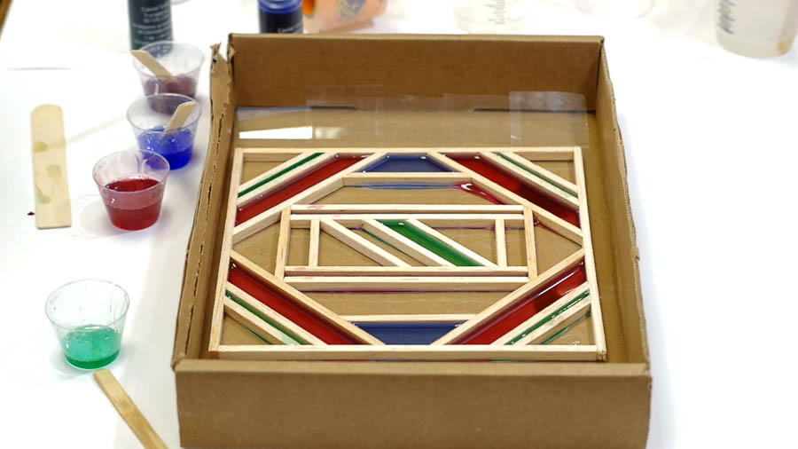 Wood Framed Faux Stained Glass- pour colored resin into frame as you like via @resincraftsblog