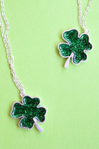 Make a shamrock necklace for Saint Patrick's Day with resin and glitter!