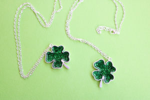 Make a shamrock necklace for Saint Patrick's Day with resin and glitter!