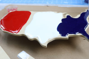 pouring resin onto a united states cutout