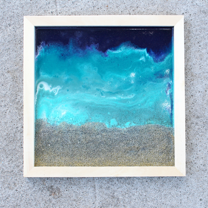 Abstract Colorful Resin Paint Pour with Sparkle on Wood