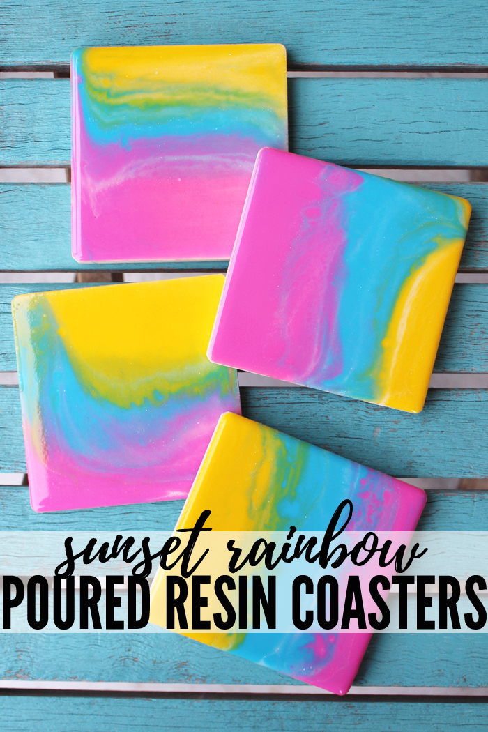Make stunning sunset rainbow poured resin coasters with envirotex lite.  Resin pouring with acrylic paint and blended for the perfect shiny finish.  #resincrafts #resincraftsblog #envirotexlite via @resincraftsblog