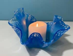 Blue resin candle holder by @foxflowart on instagram.
