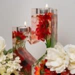 Flower resin candle holders with lit tealights.