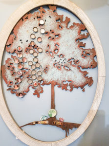Bottle cap family tree with resin