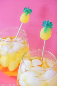 pineapple drink stirrers in glasses