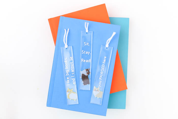 cute resin bookmarks made with EasyCast on a stack of colorful books