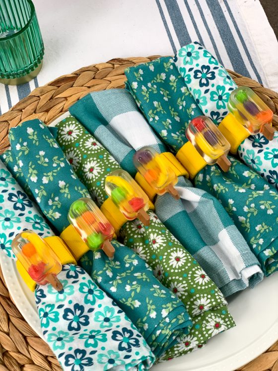 These DIY "fruit filled" popsicle napkin rings are so adorable for summer! See how she used Runts candies and resin to make these.