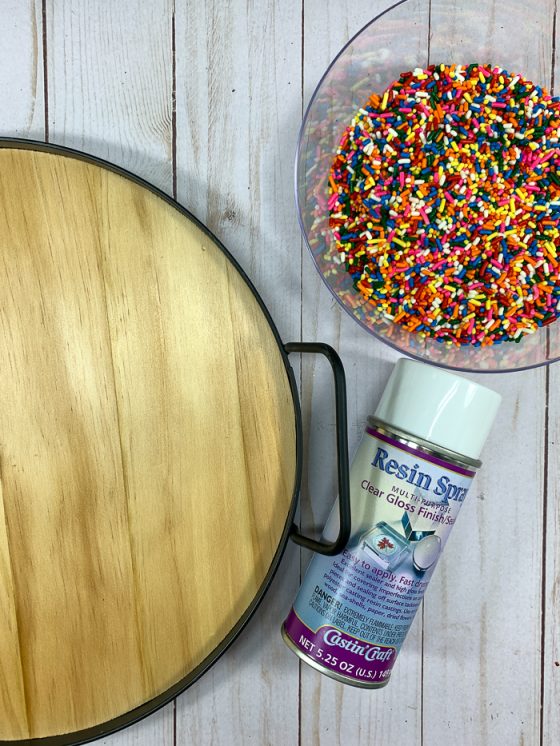 Use Castin'Craft Resin Spray to seal rainbow sprinkles before encasing them in resin.