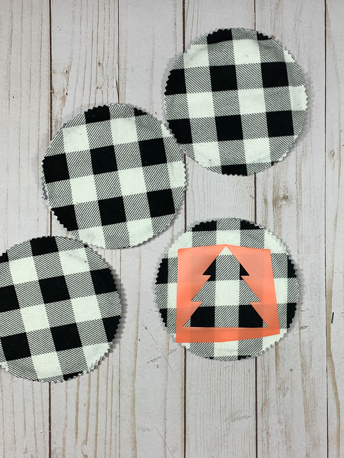 Customize DIY flannel coasters with a stencil.