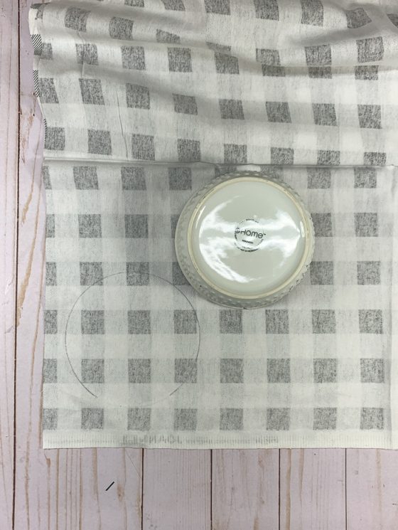 To make no-sew flannel coasters, trace a bowl onto the back of flannel fabric.