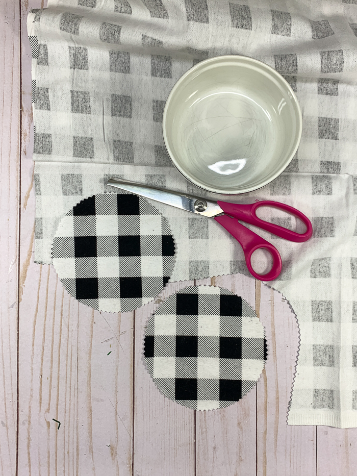 Cut out the flannel fabric with pinking shears to make DIY coasters.