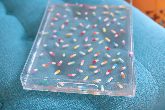 tray with polyester resin and faux pills embeded