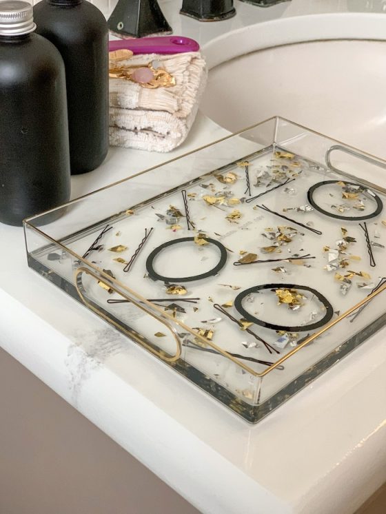 Embed hair accessories in resin to create this cute vanity tray.