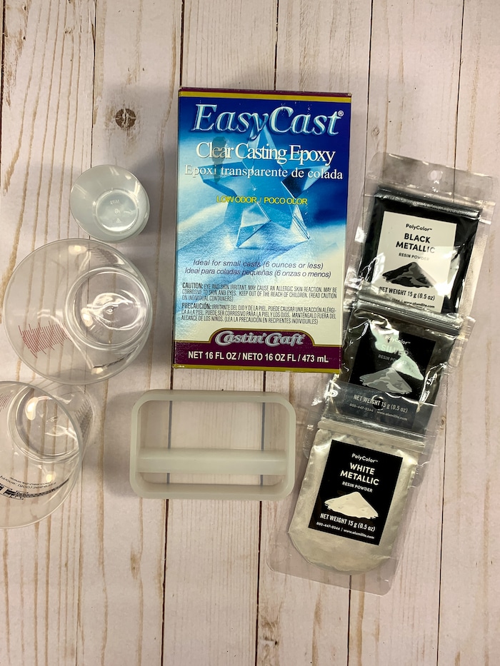 EasyCast Clear Casting Epoxy and PolyColor Resin Powders are used to make a custom DIY phone stand.
