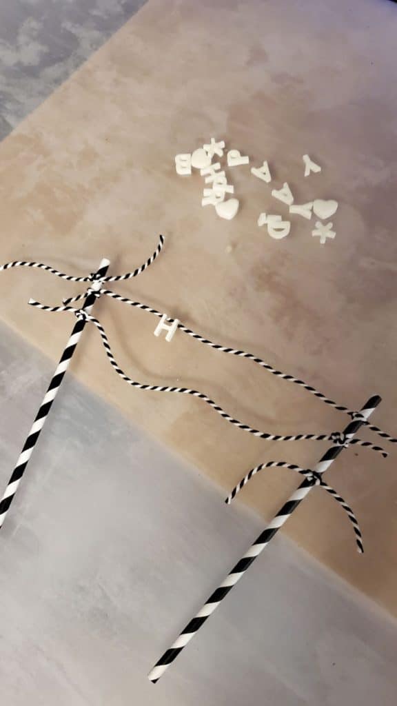 Use bakers twine and paper straws with your FastCast resin letters for the perfect cake topper.