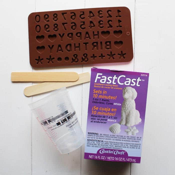 Supplies needed for creating a resin cake topper.